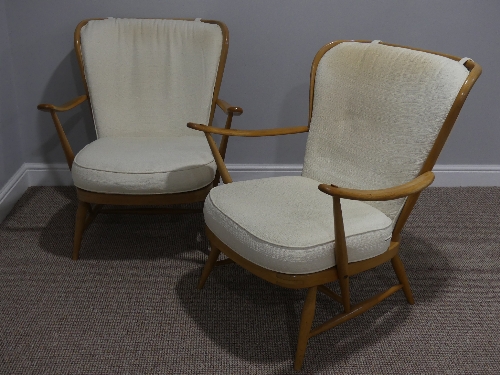 A pair of mid 20thC Ercol beech spindle back Easy Chairs, Model 477, the frame stamped 'Reg.Des