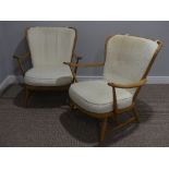 A pair of mid 20thC Ercol beech spindle back Easy Chairs, Model 477, the frame stamped 'Reg.Des