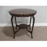 An Edwardian mahogany piecrust Occasional Table, with cabriole legs and circular undertier, 29in (