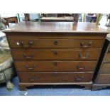 A Georgian oak Chest of Drawers, with four graduated long drawers, all raised on bracket feet,