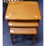 A retro teak Nest of three Tables, the largest one in size: 20½in (52cm) wide x 18in (45cm) deep x