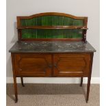 An Edwardian mahogany marble topped Washstand, with green tile back, on castors, 41½in (106cm) wide,