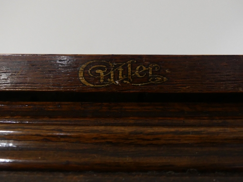 An early 20thC American oak roll top Desk, marked 'Cutler', the serpentine tambour front revealing - Image 3 of 5