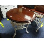 A cast iron and mahogany circular 'Pub' Table, the white painted base with moulded ram mask and