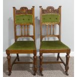 A pair of Edwardian oak Parlour Chairs, with turned front supports on castors, 19in (48.5cm) wide,