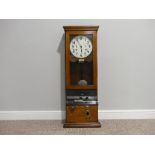 An early 20thC oak cased Clocking-In Machine, c.1930's, of traditional form, the white dial