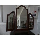 An Edwardian mahogany framed Triptych Mirror, of arched form, with bevelled edged mirror plates,