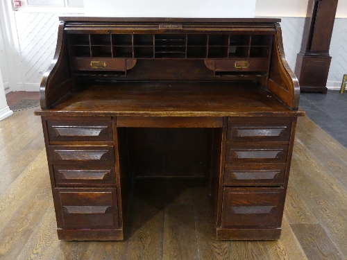An early 20thC American oak roll top Desk, marked 'Cutler', the serpentine tambour front revealing - Image 4 of 5