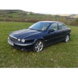 A 2007 Jaguar X-Type 2.5 AWD Saloon, automatic, blue, tan leather interior with walnut trim, the