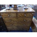 A Victorian satinwood Chest of Drawers, with two short drawers over three long, turned supports,