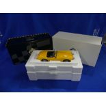 An Exoto 'Racing Legends' series 1:18 scale model of the 1964 Shelby Cobra 260, yellow, in