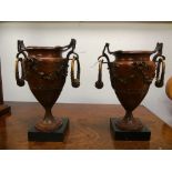 A pair of Early 20th century French bronze urns, with ring handles, 7½in (19cm) high (2)
