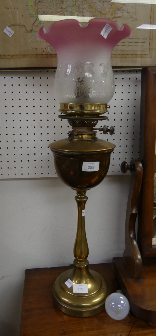 A vintage brass Oil Lamp, with pink tipped frosted glass shade, now converted for electricity, 26¼in