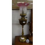 A vintage brass Oil Lamp, with pink tipped frosted glass shade, now converted for electricity, 26¼in