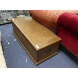 A wood grain effect pine Blanket Box, with two brass carry handles, 43¼in (110cm) long, 18in (4cm)