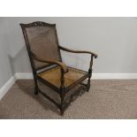 An early 20thC oak Bergere Armchair, 26½in (67cm) wide, 23in (58cm) deep, 37in (97cm) high.