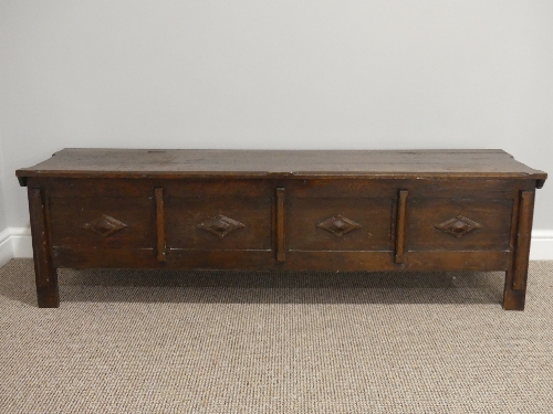 An early 20thC oak four panelled Coffer, each panel with applied diamond shaped carved decoration,