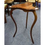 An Art Nouveau mahogany Organic Table, the interesting triangular top, almost resembling the shape