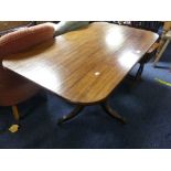 A reproduction mahogany rectangular tilt-top Breakfast Table, with turned and fluted column, leaf