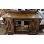 An early 20thC Continental carved oak pedestal Sideboard, with single central drawer, heavily carved