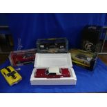 A collection of five 1:18 scale die-cast models, including Road Signature Collection 1971 Buick