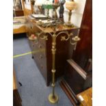 An early 20th century brass floor-standing five-light ecclesiastical Candelabrum, 54in (137cm) high.