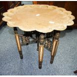 An Anglo-Indian metamorphic Benares Table, the folding hardwood stand with mother of pearl