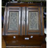 A Victorian mahogany Stationery Box, the two door sloping front opening to reveal fitted letter rack