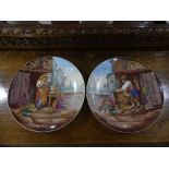 A pair of early 20th century French porcelain Wall Plates, printed and painted with figures and