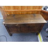 An 18thC oak three panel Coffer, with carved decoration, raised on stiles, with later additions