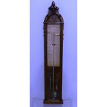 A Victorian 'Admiral Fitzroy' Barometer, in carved oak case, 9in (23cm) wide, 46½in (118cm) high.