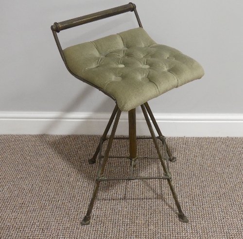 A Victorian brass Music Stool, with revolving screw column height adjust and buttoned upholstered
