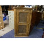 A vintage pine corner Cupboard, with two panel door, five shelf interior, 29in (74cm) wide, 50½in (