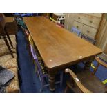 A large vintage pine Kitchen Table, with turned supports, 126in (320cm) long, 35½in (90cm) wide,