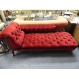 A Late Victorian mahogany-framed Chaise Longue, button-back with red upholstery, raised on turned