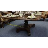 A George III mahogany Breakfast Table, the rectangular top with a turned and fluted column on a