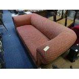 A late Victorian Chesterfield sofa, with red upholstery, on short turned front supports, 80in (