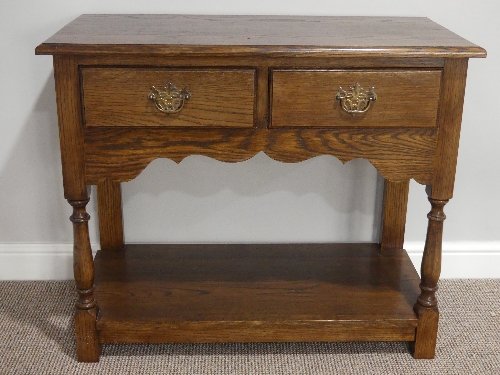 A George III style oak Side Table, with two drawers, turned supports united by an undertier, 36in (