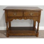 A George III style oak Side Table, with two drawers, turned supports united by an undertier, 36in (