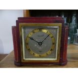 A red leather cased Elliott clock, by Swinden & Sons, Birmingham, 6½in (16.5cm) wide x 5½in (14cm)