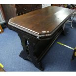 A Continental oak Refectory type Table, the rectangular top with canted corners and moulded rim, the