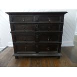 An 18th century oak Panelled Chest, of two short and three long drawers, on block feet, 37½in (95cm)