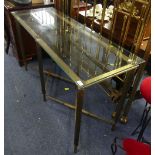 A mid 20thC glass and brass Console Table, the glass top raised upon twist-effect supports, with a