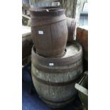 A large iron bound oak Barrel, diameter of top 23in 58.5cm), 38in (96cm) high, metal deteriorated.