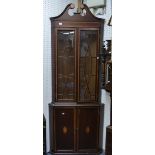 An Edwardian inlaid mahogany corner Display Cabinet, the two door panelled cupboard below a two door