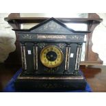 A Victorian slate and marble Mantle Clock, 16¼in (41cm) wide, 15in (40cm) high.