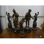 A pair of 19thC French patinated Spelter Figures, depicting a lady sniffing flowers and a young