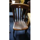 A near matched set of seven provincial oak Dining Chairs, with slatted stick backs, shaped seats and