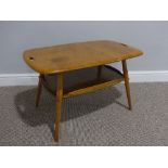 A mid 20thC Ercol beach and elm Tray Table, Model 457, the rounded rectangular tray top with two cut