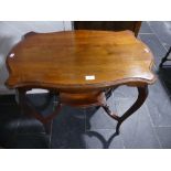 An Edwardian mahogany two tier Occasional Table, with shaped rectangular top, 29½in wide x 17½in